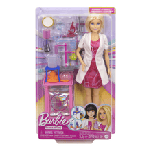 Barbie scientist doll in lab coat and pink dress with laboratory accessories, in package