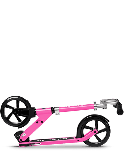 Cruiser Pink kick scooter side view, pink frame and deck, black wheels