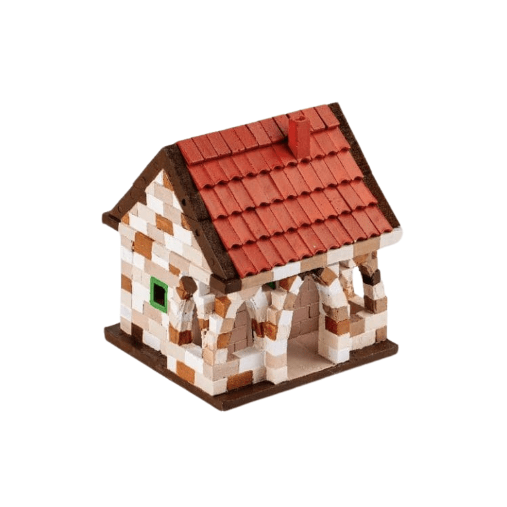 Brick house model with white-gray walls, red roof, and small green window