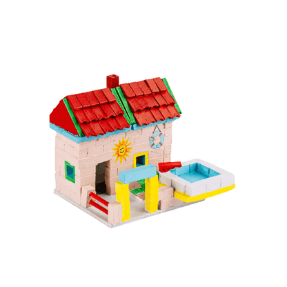 Assembled modern dollhouse with cream walls, red roofs, blue trim, and open patio