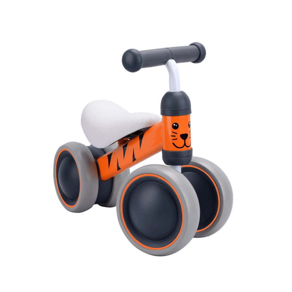 Tiger face baby balance bike, orange frame, white seat, gray wheels and handlebar