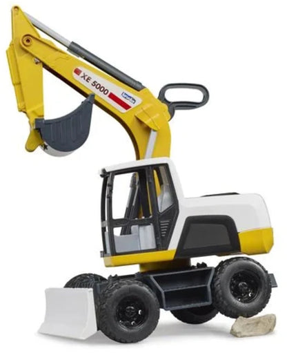 Bruder excavator toy with yellow arm, dark bucket, cab, and four black tires