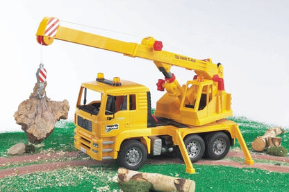 Yellow crane truck with extended boom and metal hook on a cable
