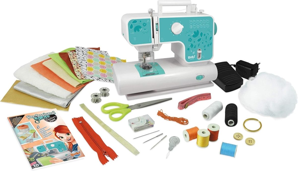 Teal-and-white sewing machine with fabric swatches, thread, bobbins, scissors, and clips