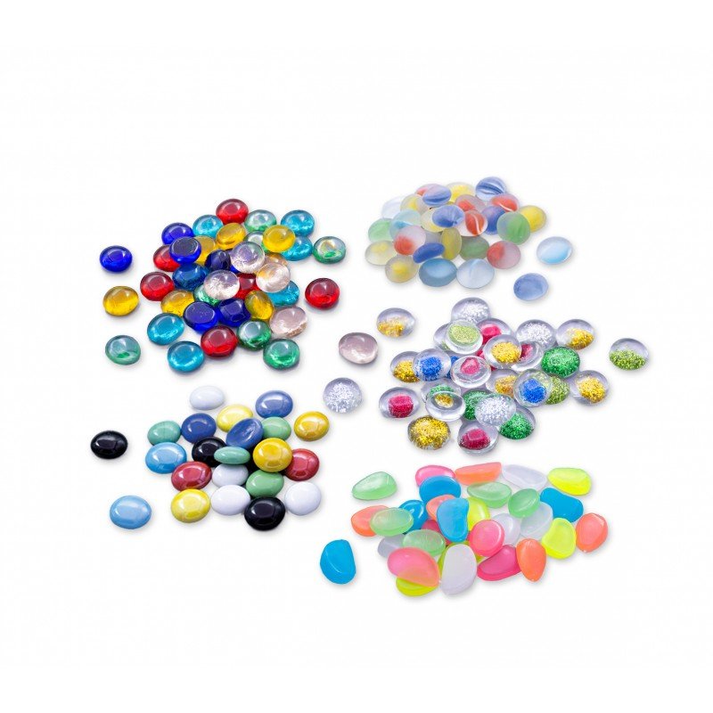 Assorted colorful plastic marbles, mixed sizes and finishes, scattered
