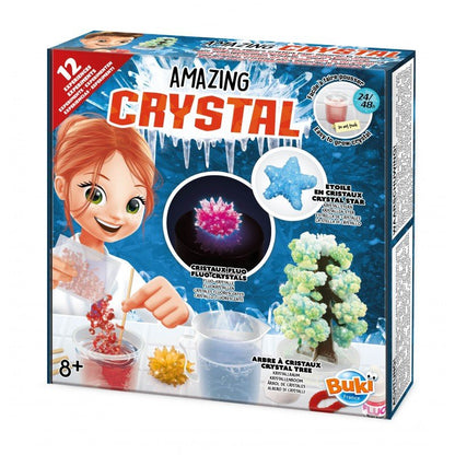 Crystal growing kit box with illustrated child and colorful crystal shapes