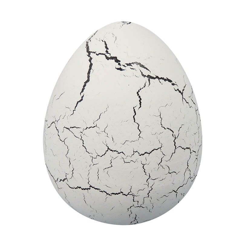 Cracked white dinosaur egg collectible toy with black crack lines