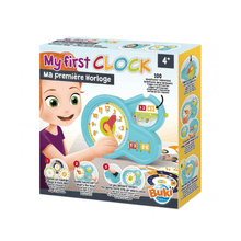 Children's learning clock toy in turquoise box with illustrated kid and clock face