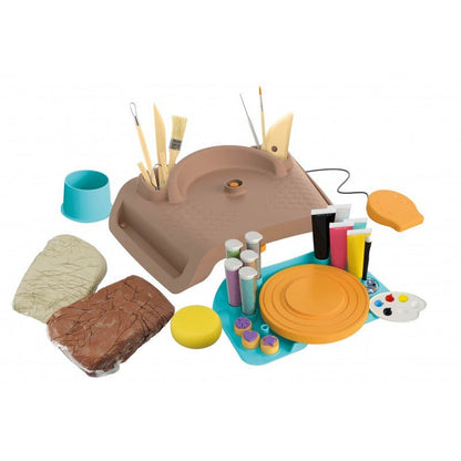 Pottery making kit tray with tools, clay blocks, cups, sponges, and paint supplies
