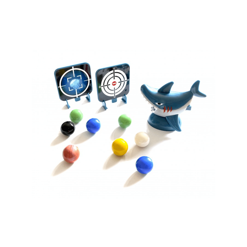 Blue shark marbles launcher figure with target cards and scattered colorful marbles