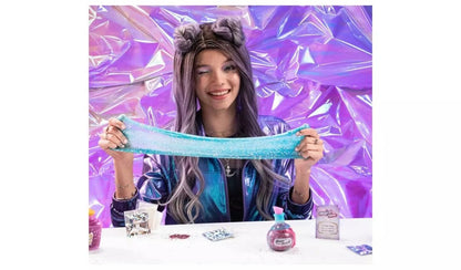 DIY slime kit activity: girl holding a long blue glitter slime strand