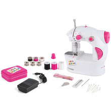 Toy sewing machine set with white and pink machine, spools, needles, and accessories