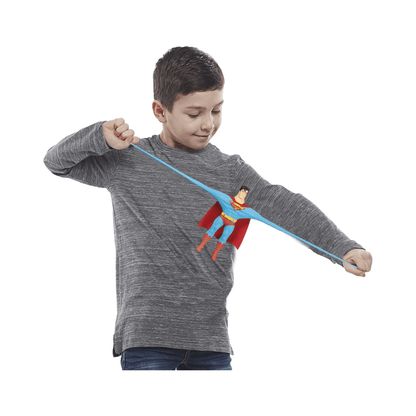 Superman mini stretch toy held by boy, stretched blue superhero figure