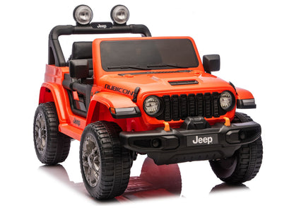 Orange Jeep Rubicon-style ride-on vehicle, front 3/4 view with grille and headlights