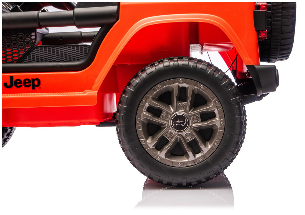 2018-2019 Jeep Rubicon toy wheel with black tire, gray spokes, orange/red body