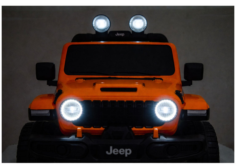 Orange/red Jeep Rubicon toy front with lit LED headlights and grille