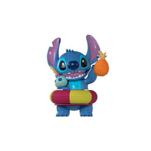 Blue Stitch fidget toy with purple ears, hugging a small turtle figure and a pineapple