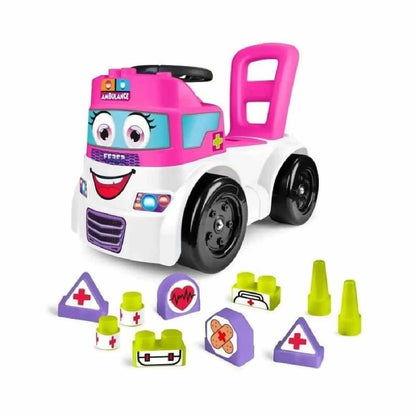 Ambulance toy vehicle in pink and white with smiling face and removable blocks