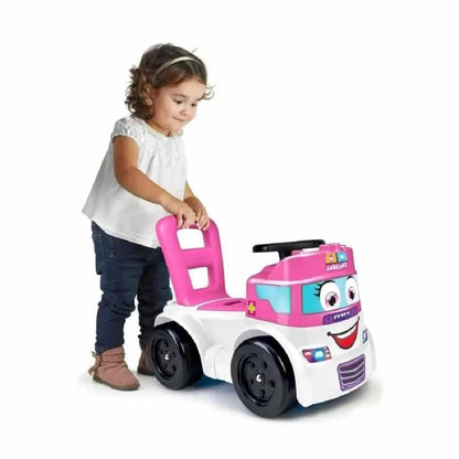 Pink and white ambulance toy vehicle with smiling face, being pushed by a child