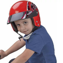 Child wearing red bike safety helmet with black visor and chin strap
