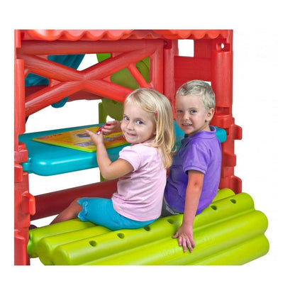 Feber wooden playhouse slide with two children on green base and blue platform