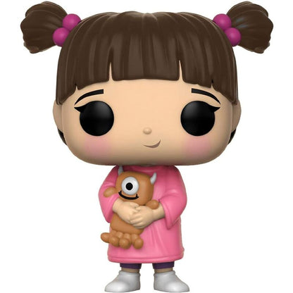 Boo vinyl figure with brown pigtails, pink dress, holding a small brown critter toy