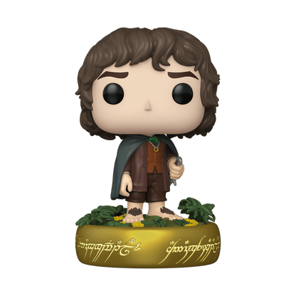 Frodo Baggins (Glow) Funko figure with dark hair, cloak, holding tool on base