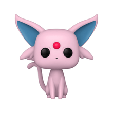 Espeon figurine close-up: pink body, blue ears, black eyes, red nose gem