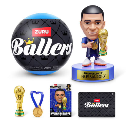Mini football player figure holding a gold trophy with mini FIFA World Cup base