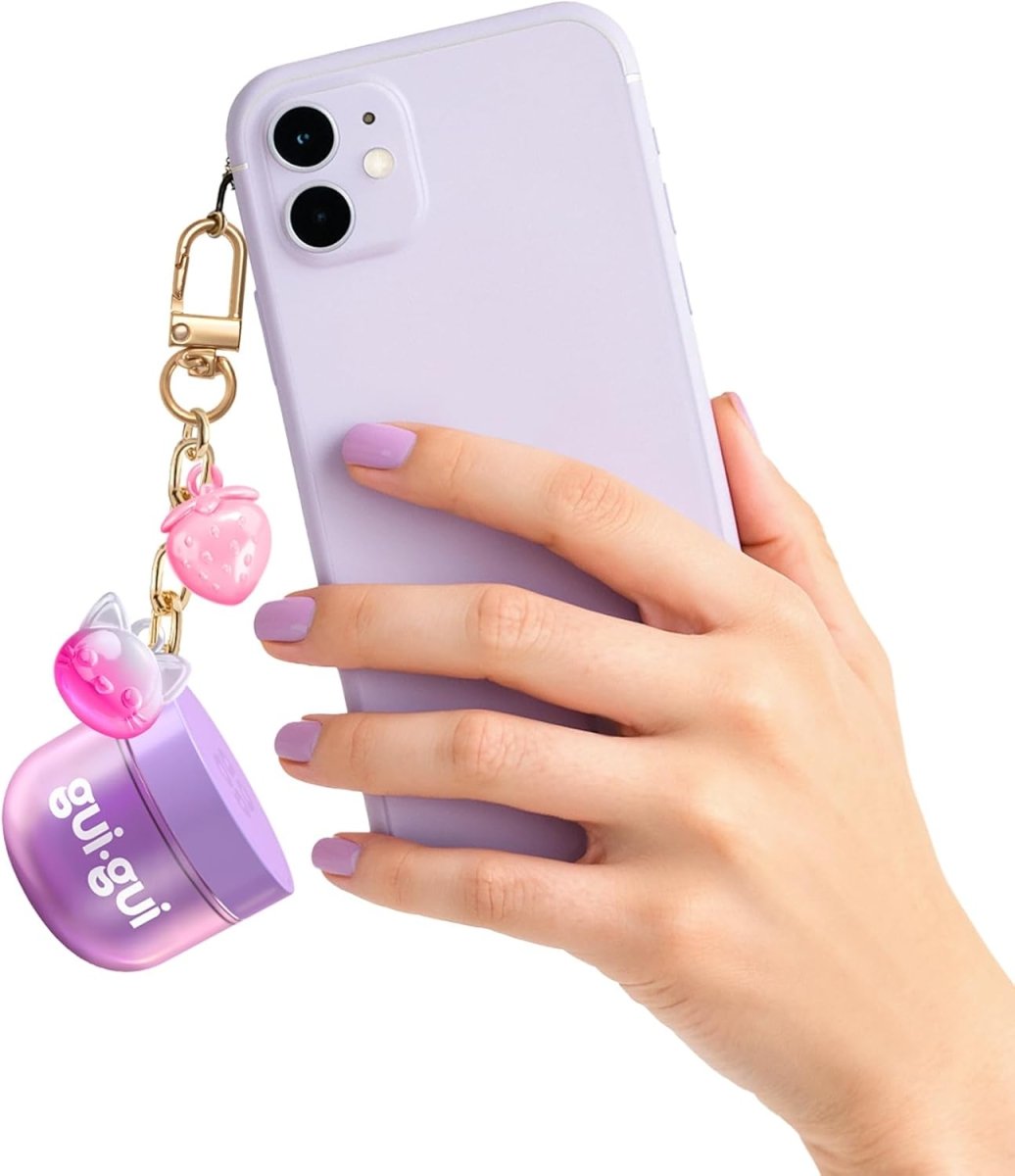 Slime Mini keychain on a lilac phone case with gold chain and pink bear charm