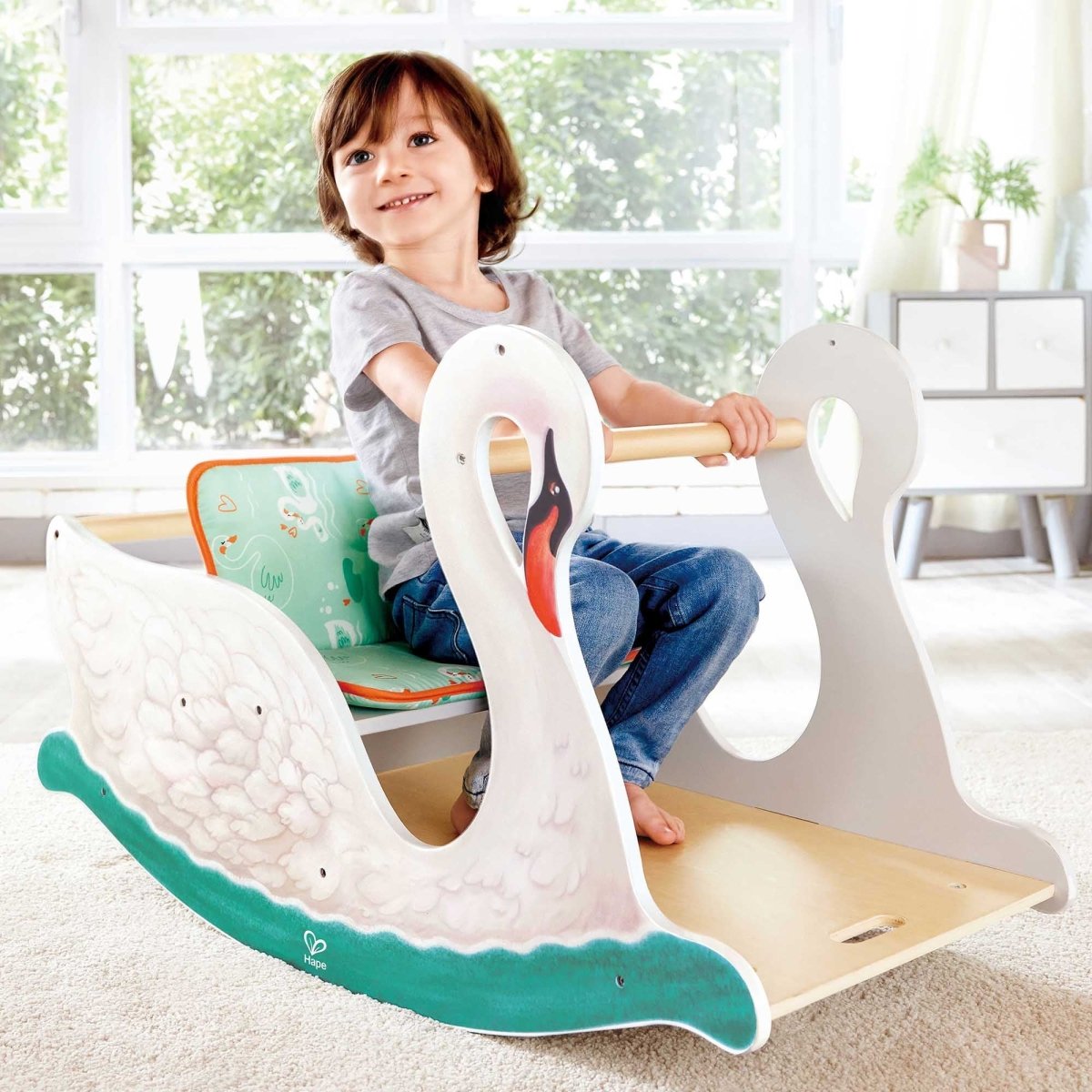 Baby rocking swan cradle with open seat, teal base edge, and white swan side handles