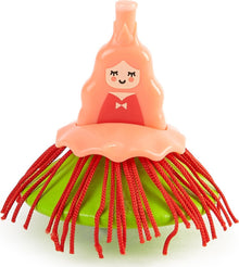 Ballerina spinning top toy with orange dancer figurine and striped fringed skirt