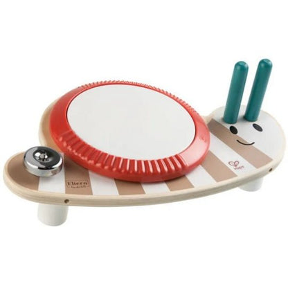 Musical toy drum with red round drumhead, teal sticks, wooden base and smiling face