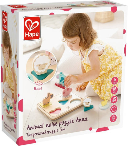 Farm animal noise puzzle package showing child playing with a five-piece animal sound puzzle