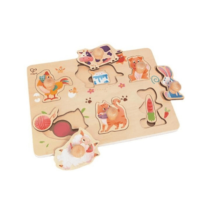 Farmyard layer puzzle with wooden pieces of farm animals and paw-print shapes