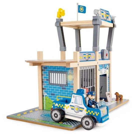 Blue police station playset with front jail bars and patrol car, two figures
