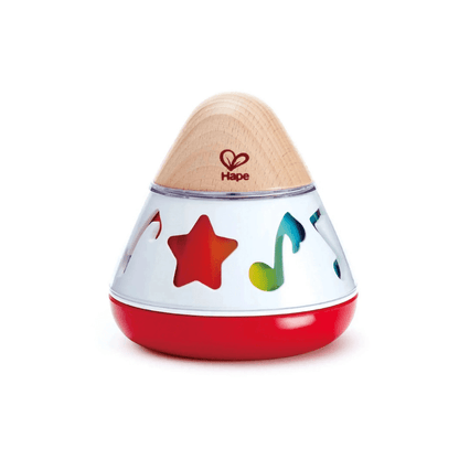 Rotating music box toy with wooden dome, white shell, red base, star and note insets