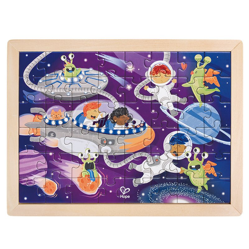 Wood-framed space jigsaw puzzle with astronaut and alien figures on interlocking pieces