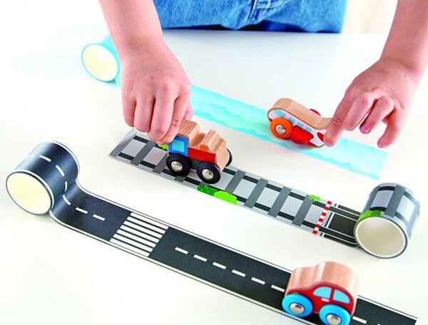 Tape and roll plane toy set with blue track and toy vehicles on road