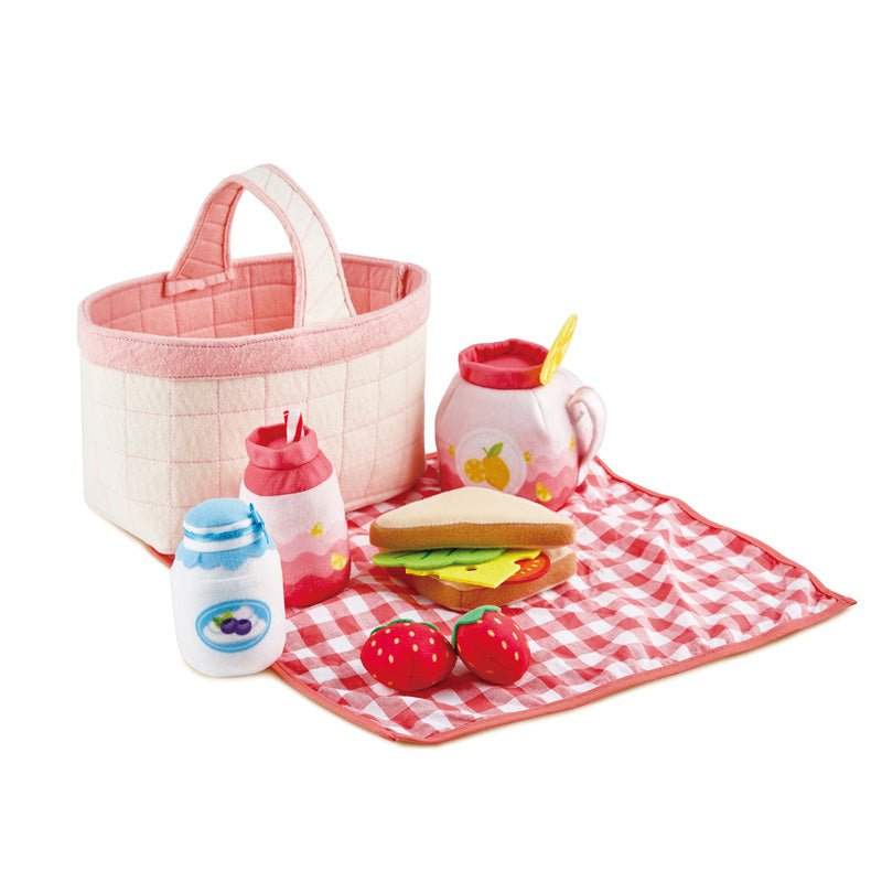Toddler picnic play set with pink-and-cream fabric tote, play food, and picnic mat