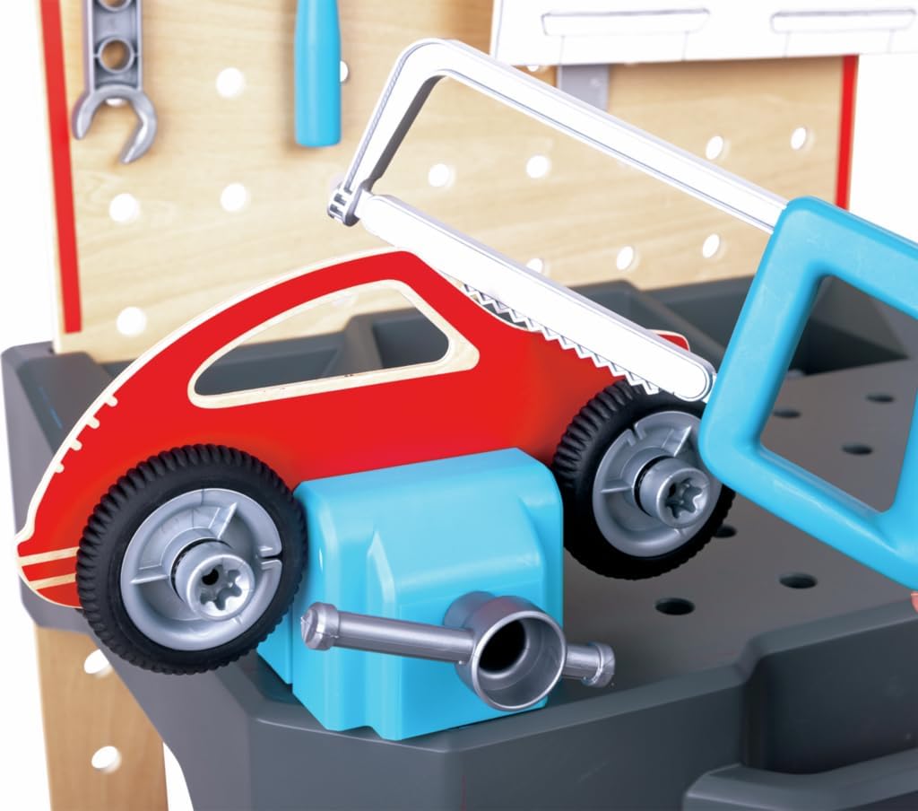 Vehicle repair workbench close-up with red toy car, blue tools, and gray tray