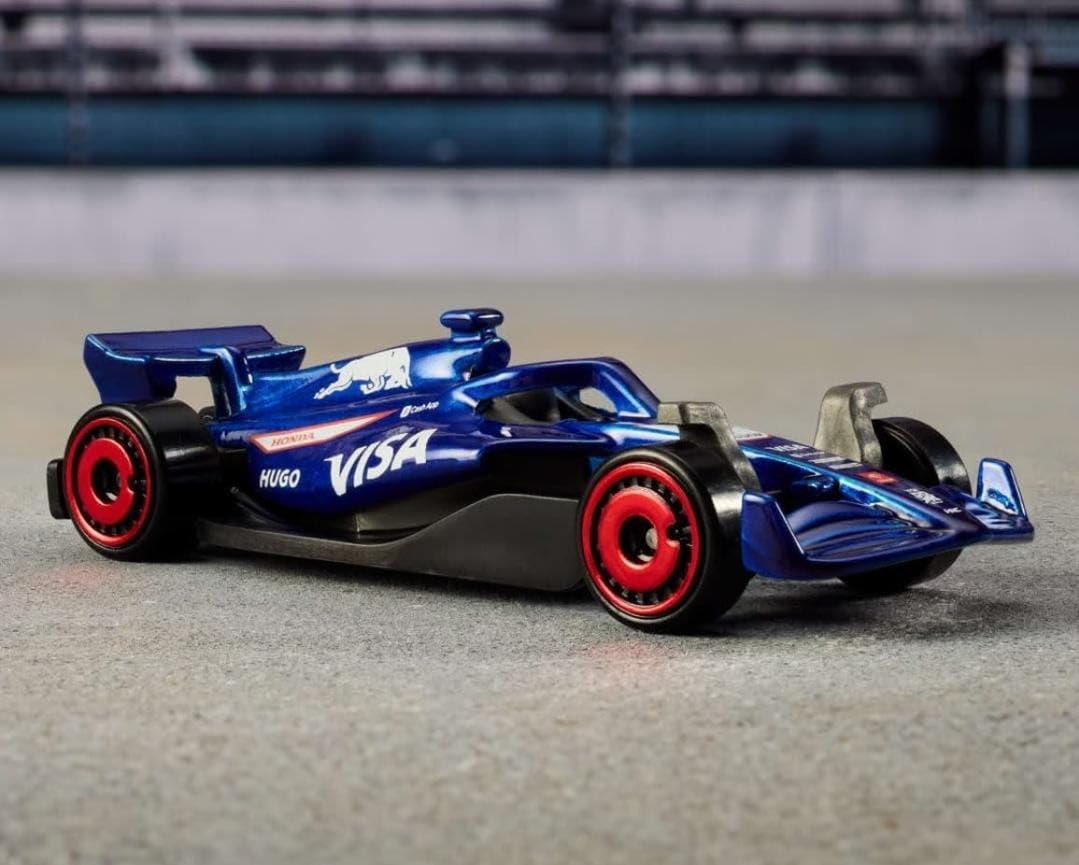 Blaues Formel-1 Die-Cast Auto mit roten Felgen und VSA-Aufklebern
