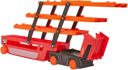 Red toy car carrier truck with black support ladder and orange upper platforms