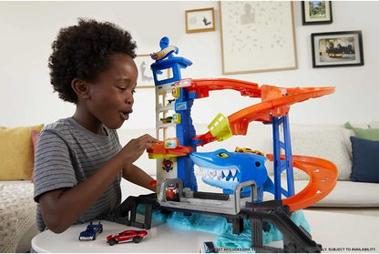 Shark-themed parking garage playset with blue shark, orange track, and toy cars