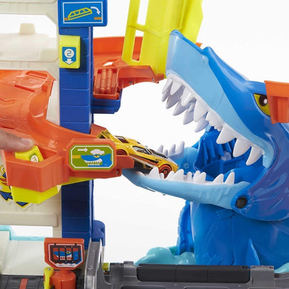 Blue shark mouth detail with toy car at orange-and-blue launcher on playset