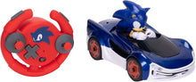 Red circular RC controller with button layout and Sonic-style blue drifting car