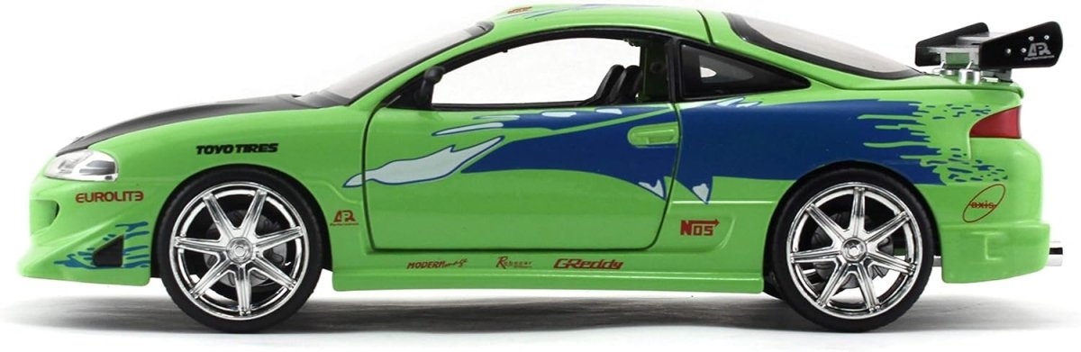 1:24 scale green Mitsubishi Eclipse model car side view with rear spoiler and chrome wheels