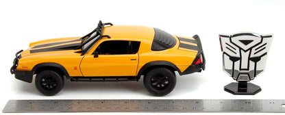 Bumblebee 1:24 car side view, yellow-orange body with black stripes and tires