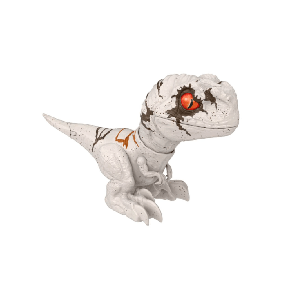 White dino action figure with orange eye and brown speckled markings