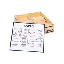 Brown wooden brick pieces inside a wooden tray with instruction sheet